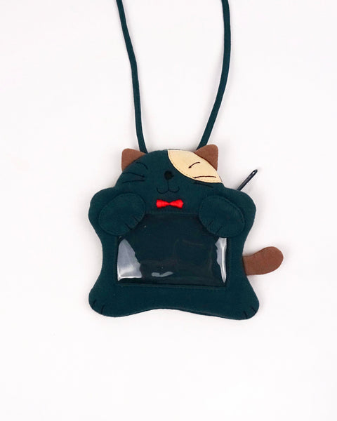 A teal green cat ID card Badge holder with two paws holding the PVC window, a lanyard attached, and a zipper pocket in the back