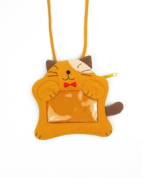A golden yellow cat ID card Badge holder with two paws holding the PVC window, a lanyard attached, and a zipper pocket in the back