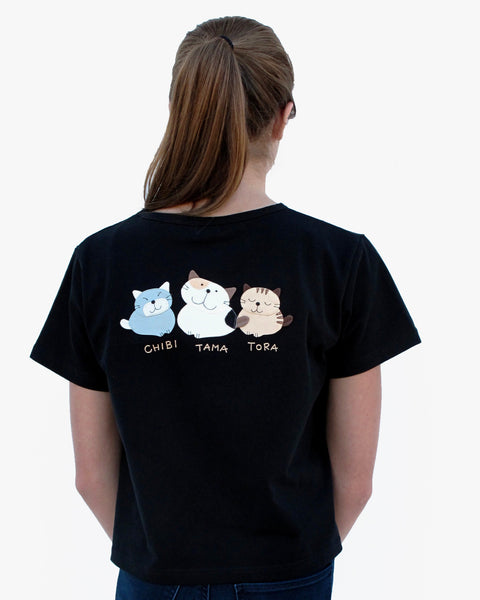 Woman wearing Cat Crop Top, in black with three cat appliqué, embroidery details, V-neck and short sleeves in close-up back view.