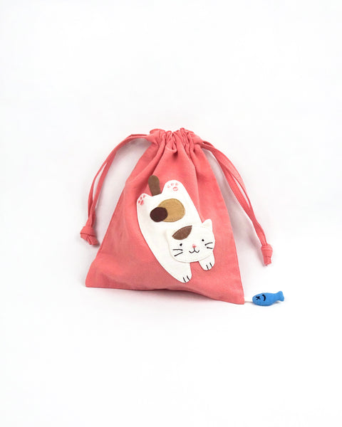 Cat Pouch in pink with cat appliqué, embroidery detail, two-sided drawstring enclosure, small blue fish hanging at the bottom right corner.