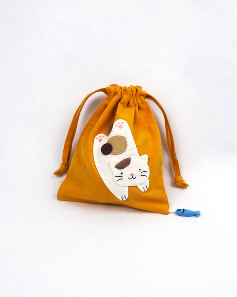 Cat Pouch in golden yellow with cat appliqué, embroidery detail, two-sided drawstring enclosure, small blue fish hanging at the bottom right corner.