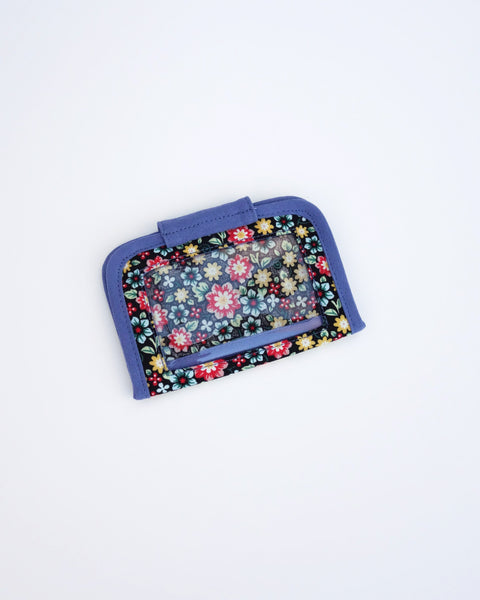 Cat Card-Case in blue blossoms with rectangular PVC back window, and Velcro flap closure in back view.