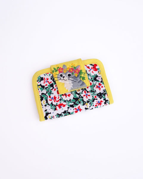 Cat Card-Case in yellow blossoms with cat appliqué, embroidery detail and Velcro flap closure in front view.