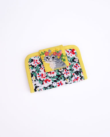 Cat Card-Case in yellow blossoms with cat appliqué, embroidery detail and Velcro flap closure in front view.