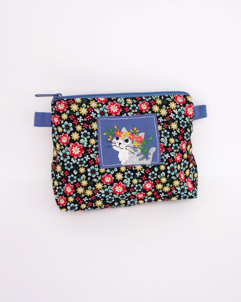 Cat Zip-Pouch in blue blossoms with embroidery detail, one main zippered compartment, two side loops for strap attachment for iPhone /small notebook / cosmetic items.
