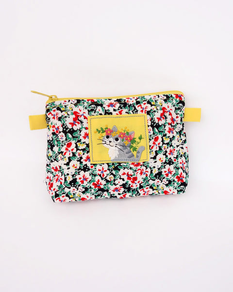 Cat Zip-Pouch in yellow blossoms with embroidery detail, one main zippered compartment, two side loops for strap attachment for iPhone /small notebook / cosmetic items.